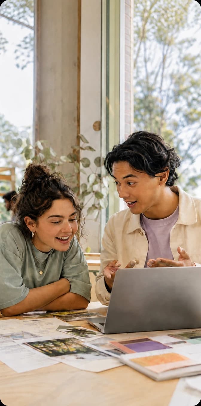Two students exploring careers together on a laptop